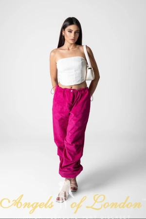 Brazilian escort Peppermint in pink trousers