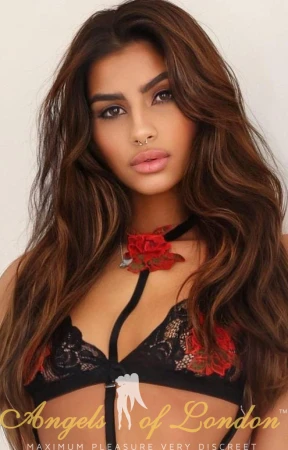 Brazilian escort Ezora with flower around neck