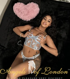 London escort Bonnita on bed