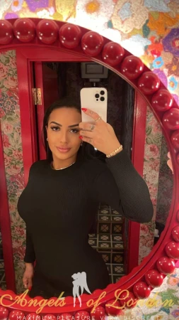 London escort Mentos selfie in black dress
