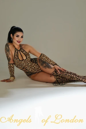 London escort Neyna in leopard print boots