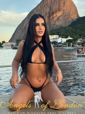 London escort Harita in bikini outdoors