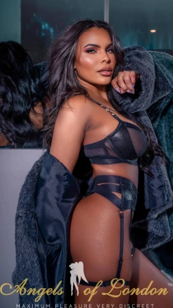 London escort Cadbury in black lingerie