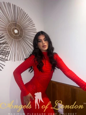 London escort Izaura in red dress