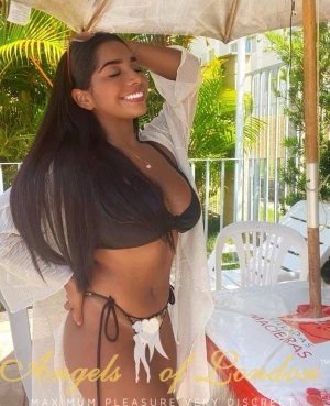 London escort Zaura smiling in bikini