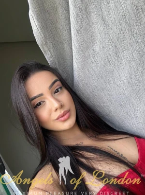 London escort Liveta in red lingerie
