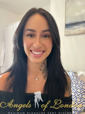 London escort Zari smiling selfie