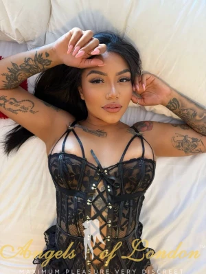 Brazilian escort Rimona laying on bed