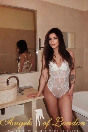 London escort Doretta in white lingerie