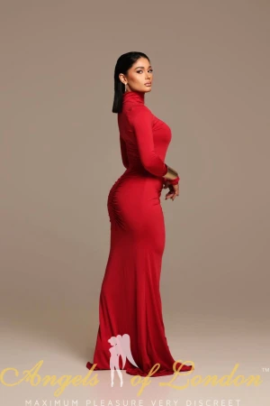 London escort Gella in red dress showing ass