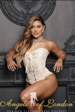 London escort Eloa in white lingerie