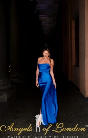 Russian escort Charotie in blue dress