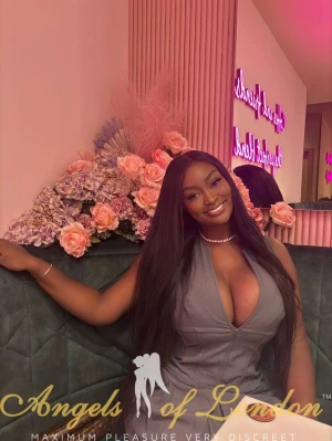 black London escort Salba in grey dress