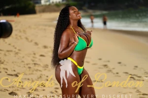 black London escort Salba on sandy beach