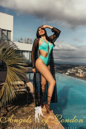 London escort Raquel in green swimsuit