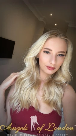 London escort Nona showing long blonde hair
