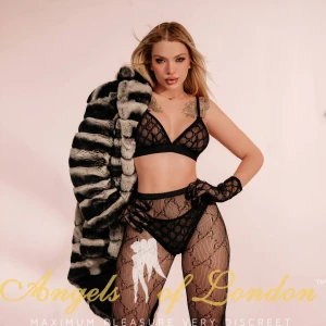 London escort Makadi in black fishnets