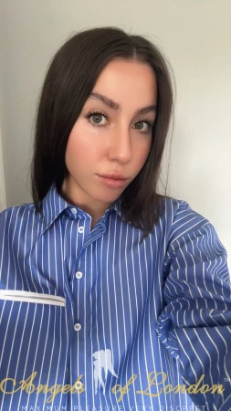 Italian escort Dizora in blue and white stripes