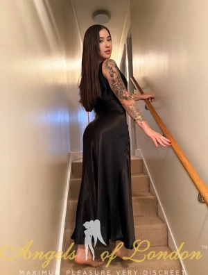 London escort Ismat in black silk