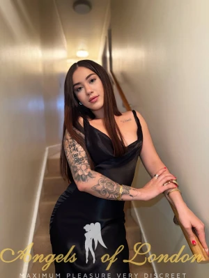 London escort Ismat in silk dress
