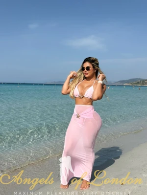 London Escort Kalina at beach in white bikini