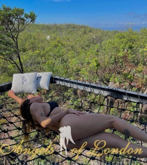 London escort Helma lying down outside