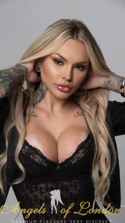 London escort Glo showing cleavage