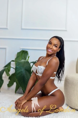 London escort Noomi in white bra