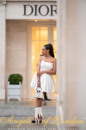 London escort Kuraga in white dress