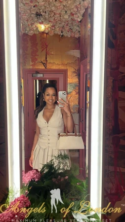 London escort Kuraga selfie in white dress