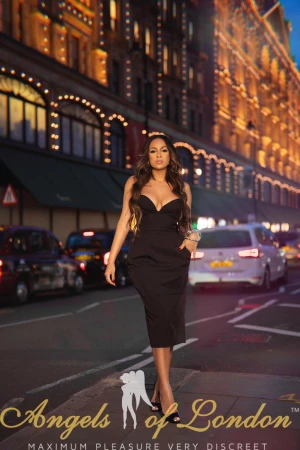 London escort Kuraga in black dress