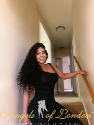 Colombian escort Ventella on the stairs
