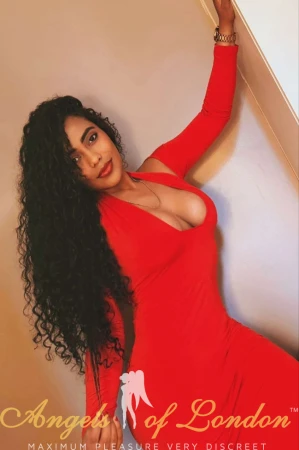 Colombian escort Ventella in red dress
