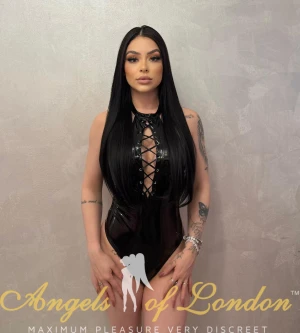 London escort Zambia in black latex