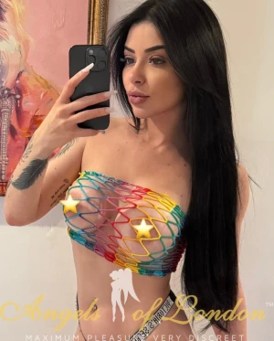 London escort Zambia with stars on her nipples