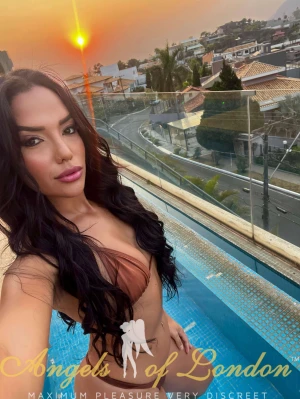 London escort Vega selfie by the pool