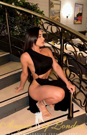 London escort Lasca sitting on stairs