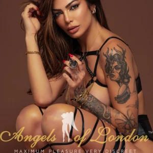 London escort Roderica showing tattoo