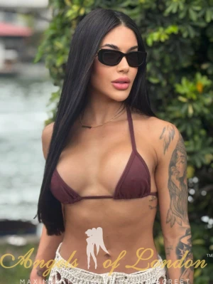 London escort Furonda in bikini and sunglasses