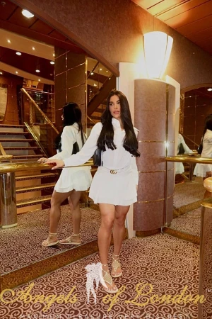 London escort Furonda in white dress