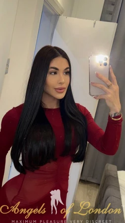 London escort Furonda mirror selfie in red top