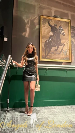 London escort Firmini on the stairs