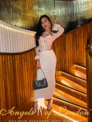 London escort Nomira on stairs